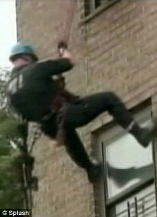 Brave police officer Martin Duffy was lowered down the tower block to fire a crucial tranquilizer dart into the tiny apartment