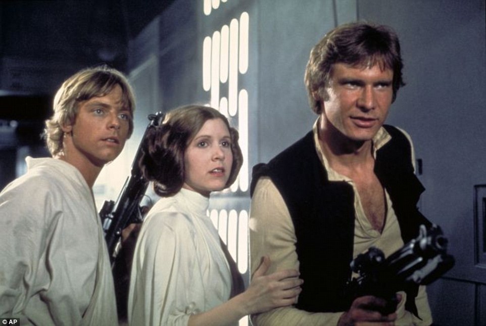 Carrie Fisher, centre, portraying the science fiction heroine with her trademark hairdo in the 1977 hit, Star Wars: Episode IV, A New Hope