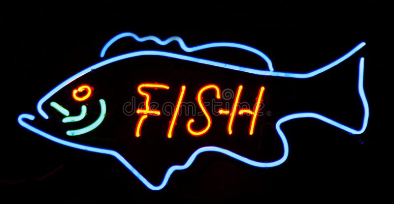 Neon big fish. Neon sign big fish letters royalty free stock photo