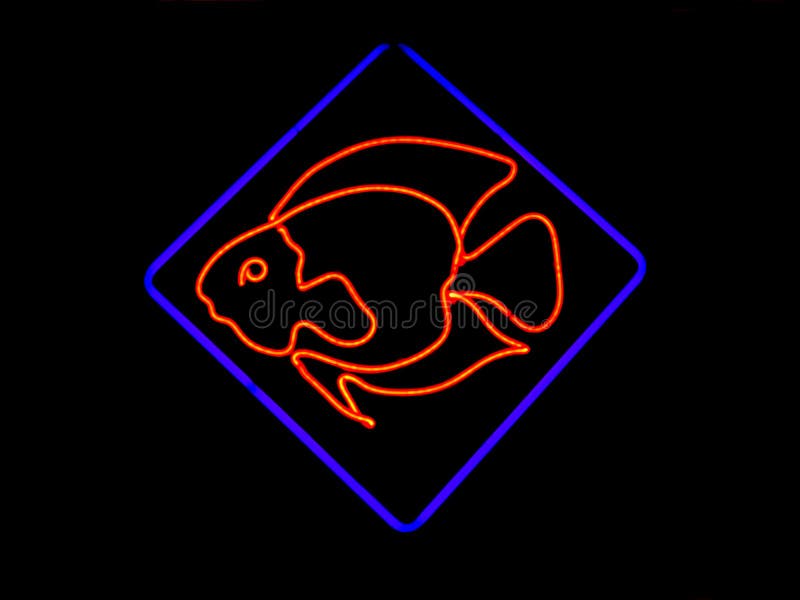 Neon Fish Shaped Sign. Neon sign shaped like a fish found in the window of restaurants, markets and pet stores stock image